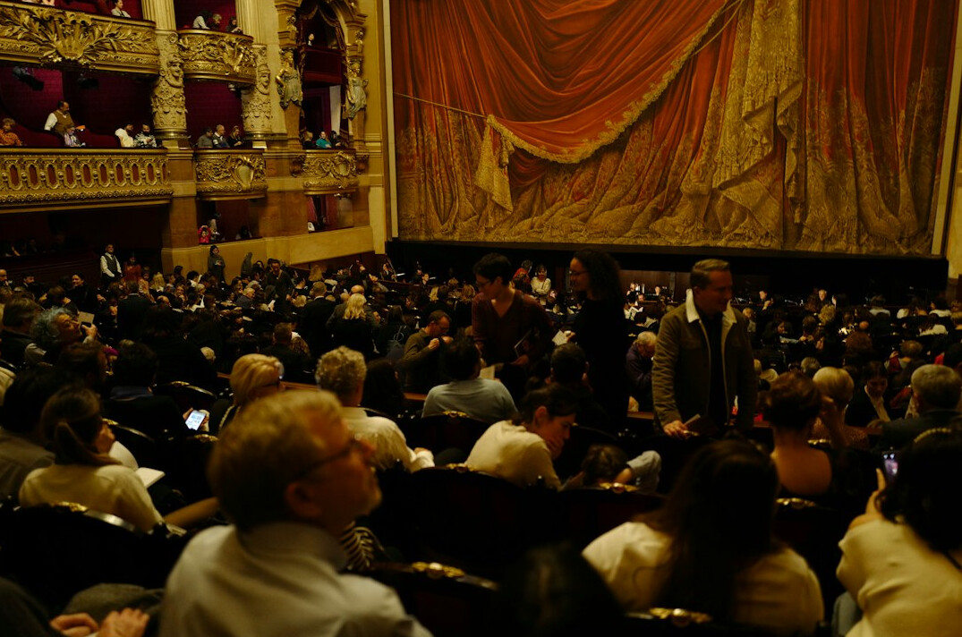 Audience seated at a conference listening to a speaker