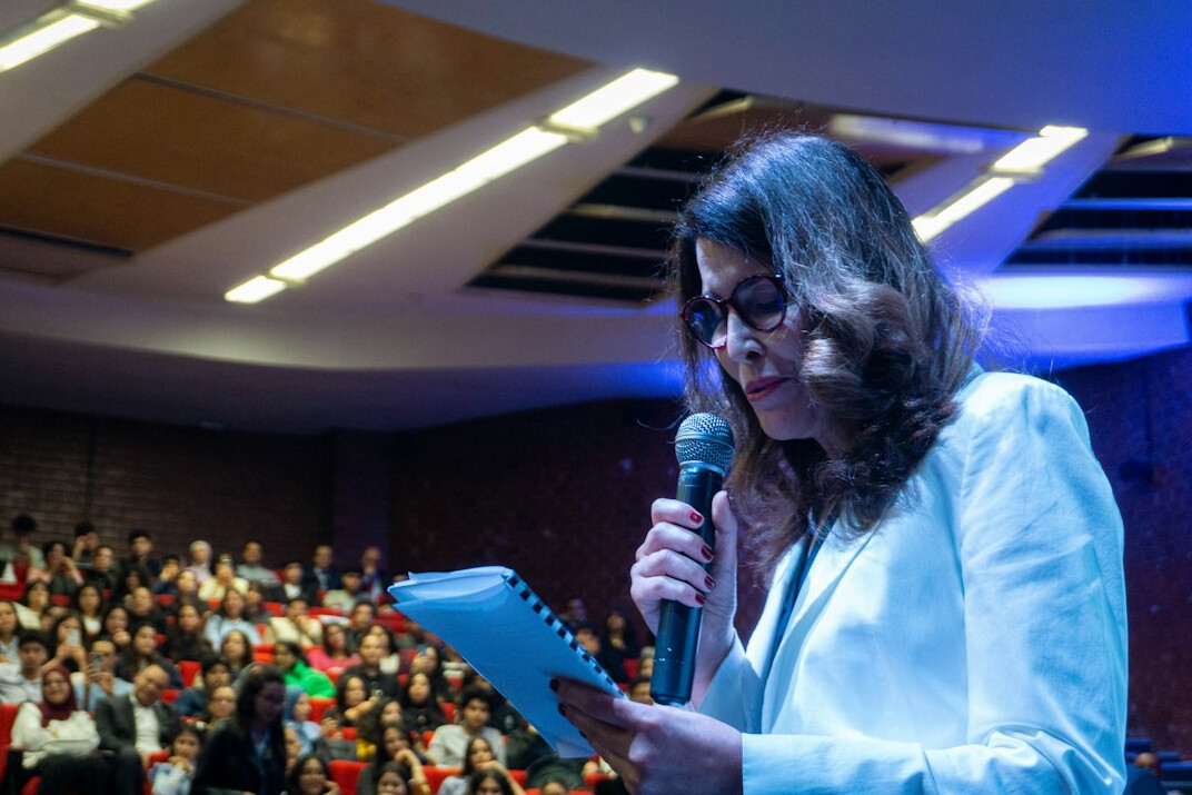 woman presenting at conference
