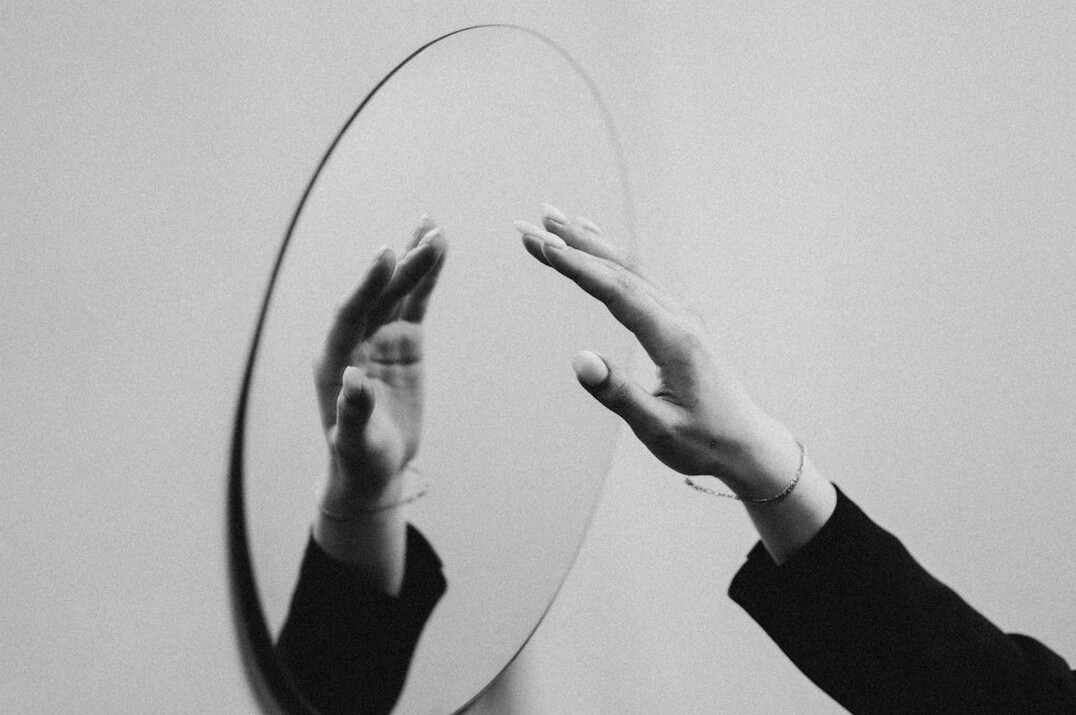 person practicing speech in mirror