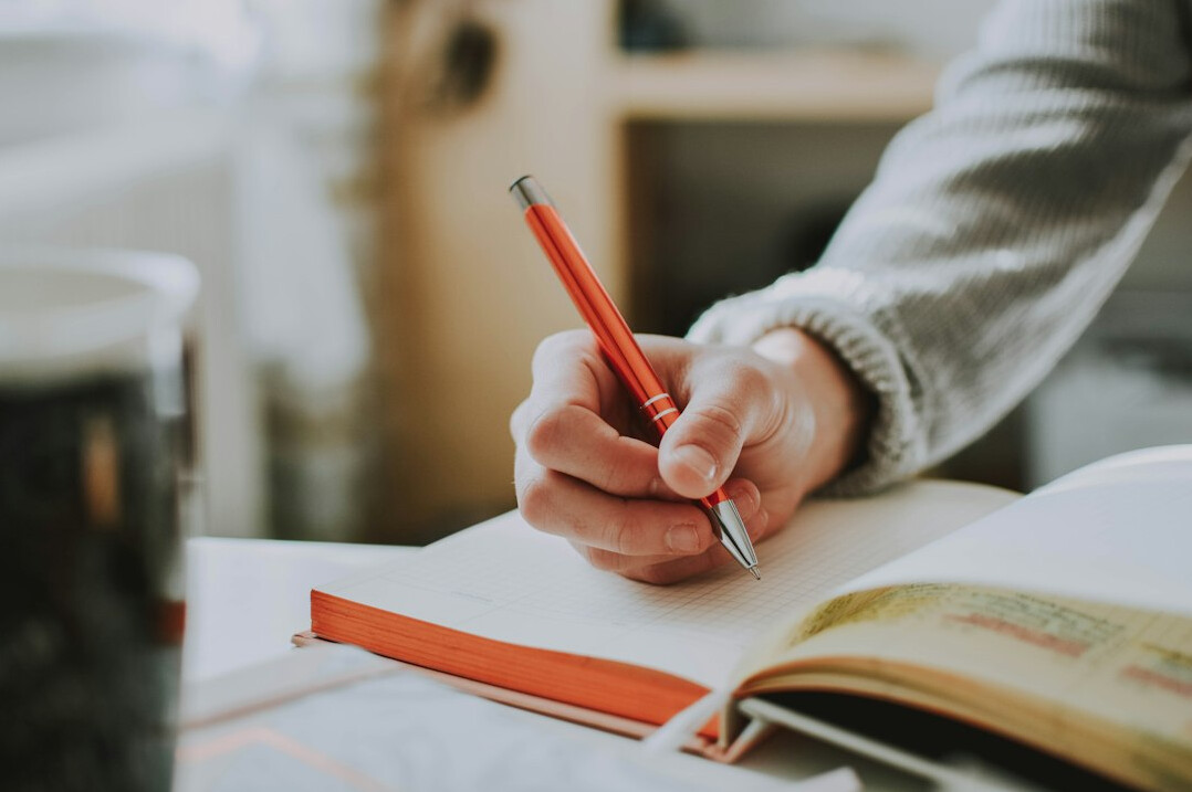 person writing goals